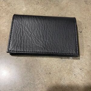 Black leather snap close card case